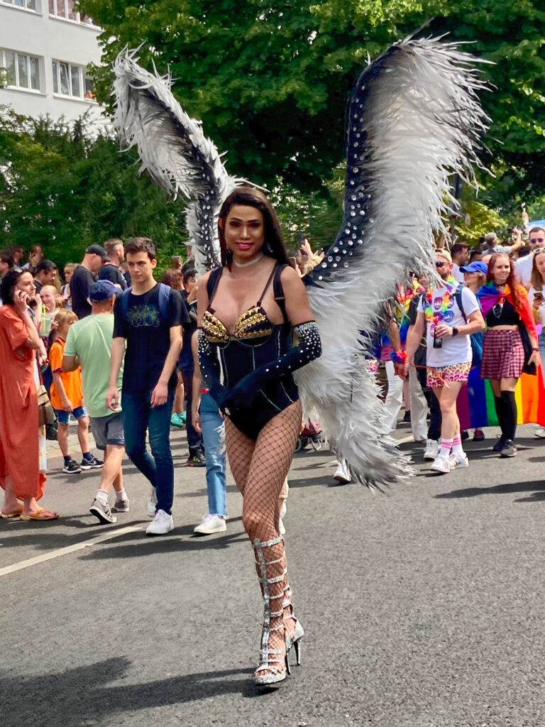 A protester wearing wings at the CSD in 2022.