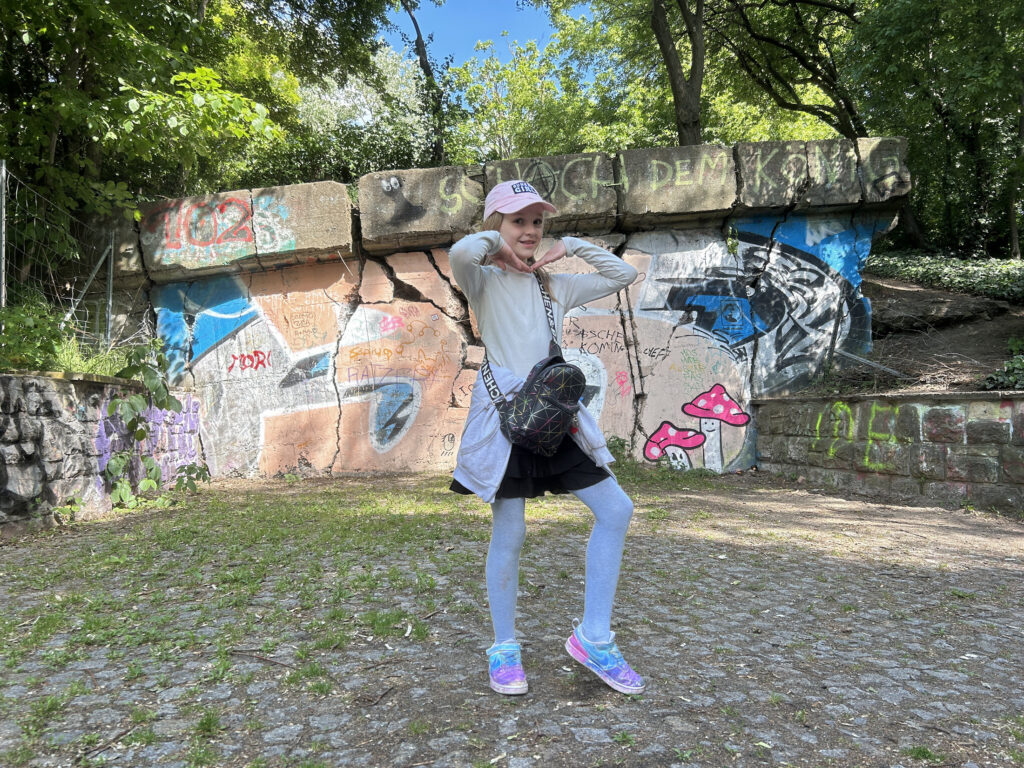 The little bunker girl posing in front of the remains of the Friedichshain flak tower.