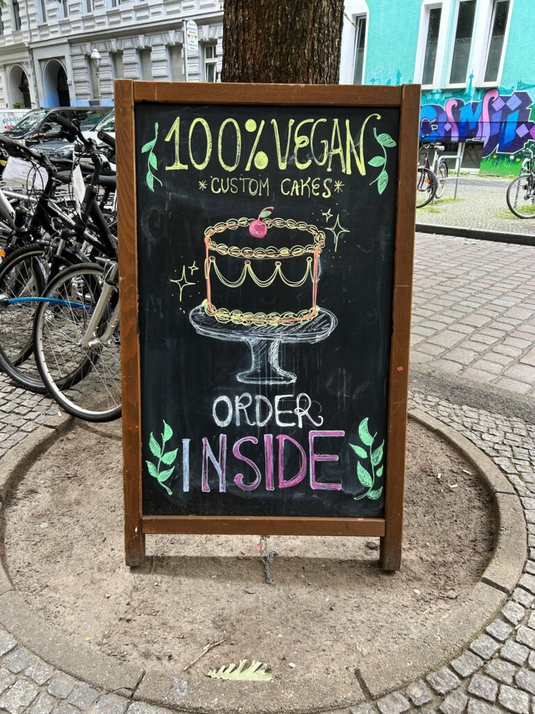 The custom cakes sign outside of C+ Bakery.