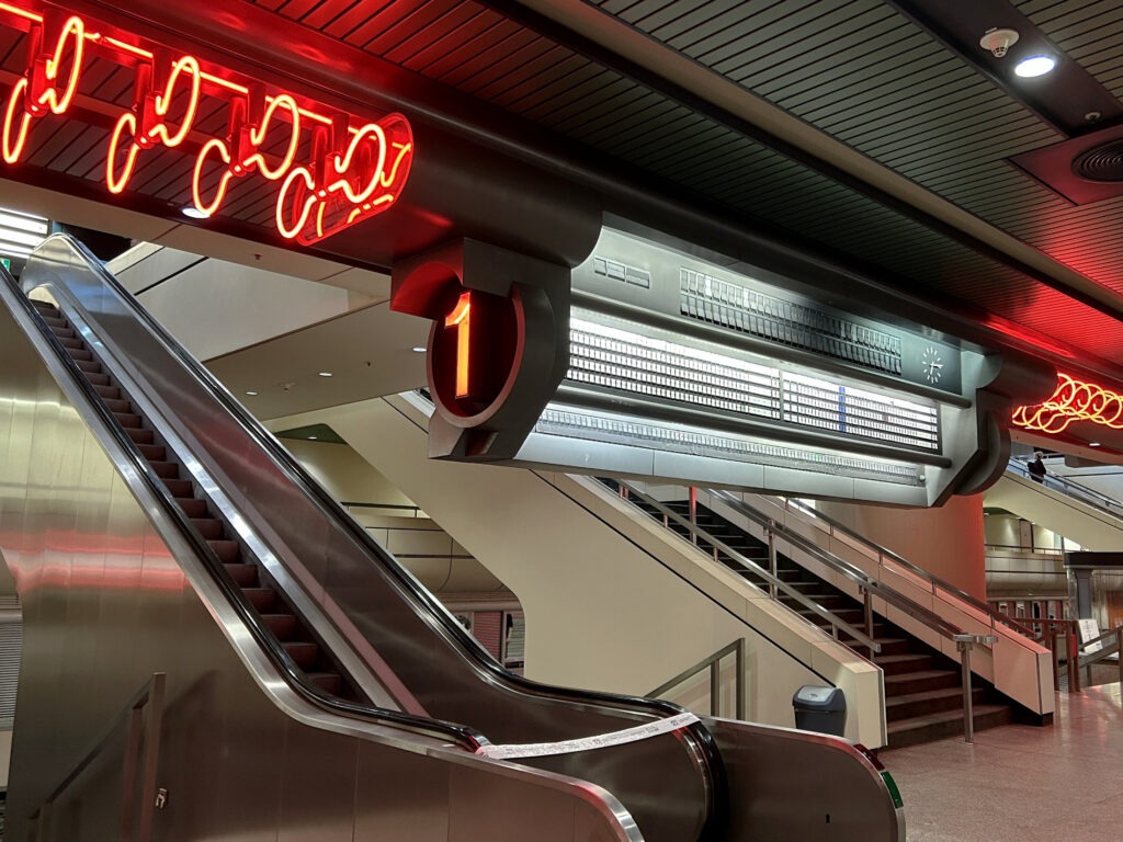 Neon decoration and chrome escalators in the ICC Berlin.